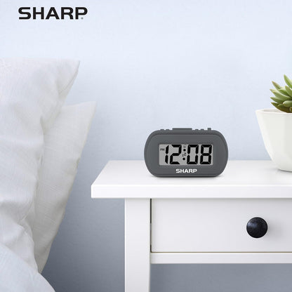 Sharp Digital Alarm Clock – Tactile Plastic Case with Soft Rubberized Finish - Battery Operated – Blue Backlight on Demand – Ascending Alarm – Easy to Use – Charcoal Black